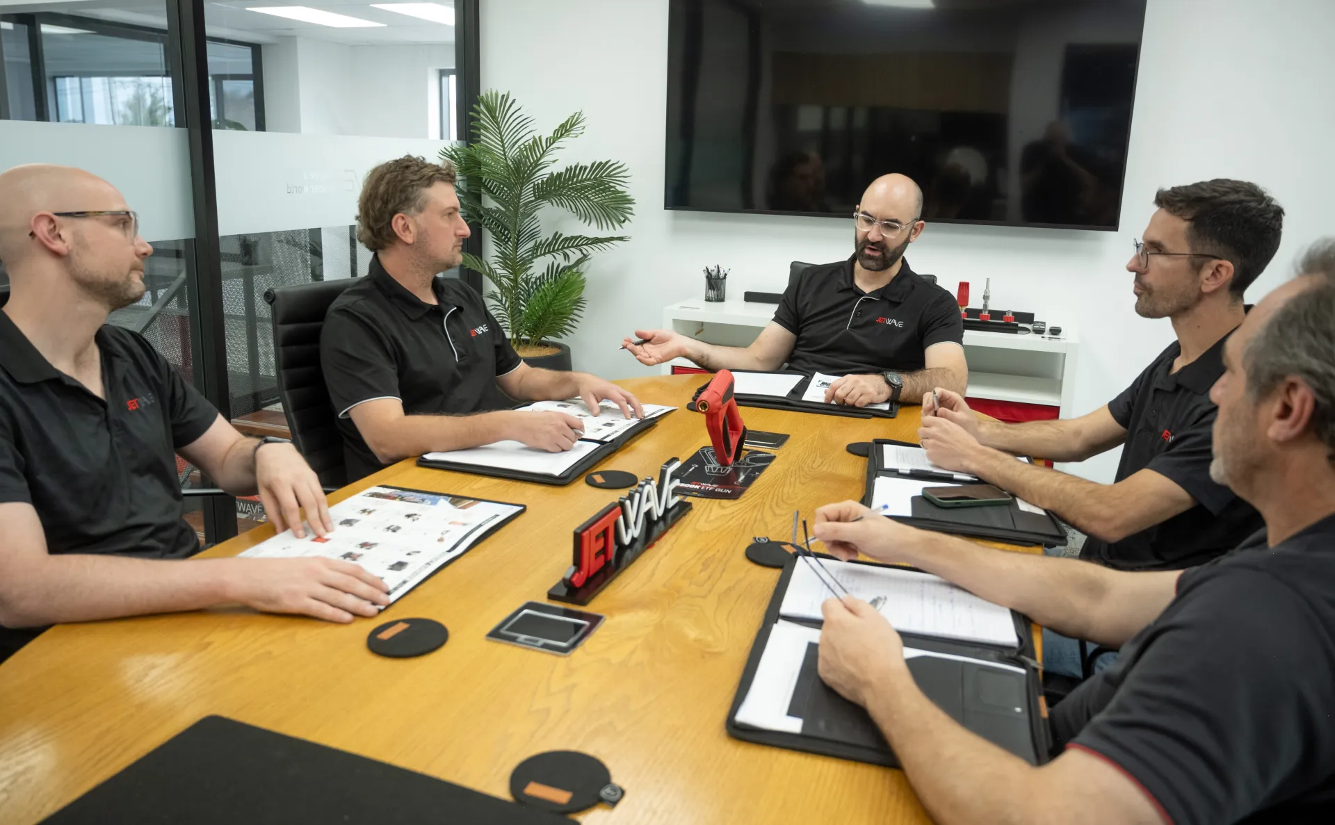 Jetwave executives meeting in a boardroom.