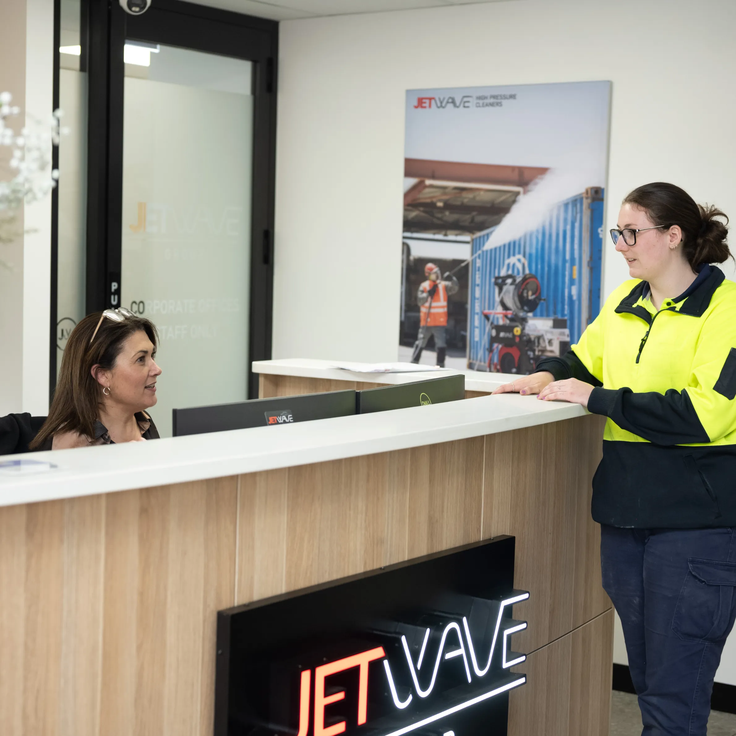 Jetwave staff having a conversation at the reception