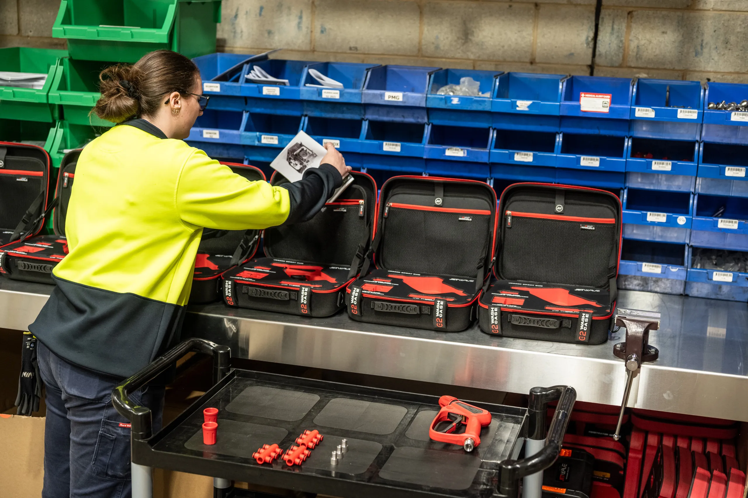 Worker packing and dispatching G2 Wash Cases